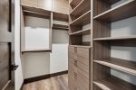 Big walk-in closet in the master with built in shelves 